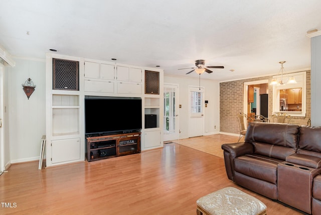 132 Lord Ashley Rd, Raleigh, NC 27610 - living area with crown molding, ceiling fan, and light wood finished floors