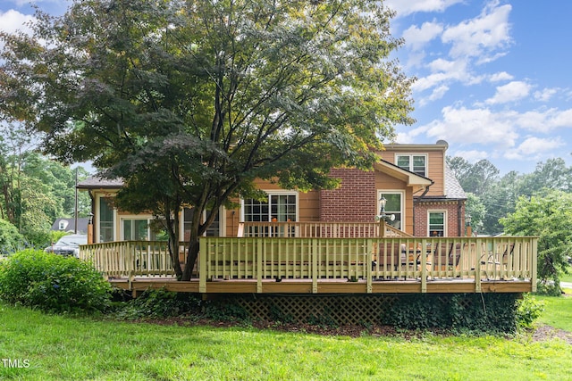 132 Lord Ashley Rd, Raleigh, NC 27610 - rear view of house with a yard, a deck, and brick siding