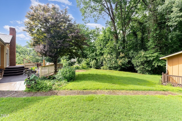 132 Lord Ashley Rd, Raleigh, NC 27610 - view of grassy yard featuring a deck