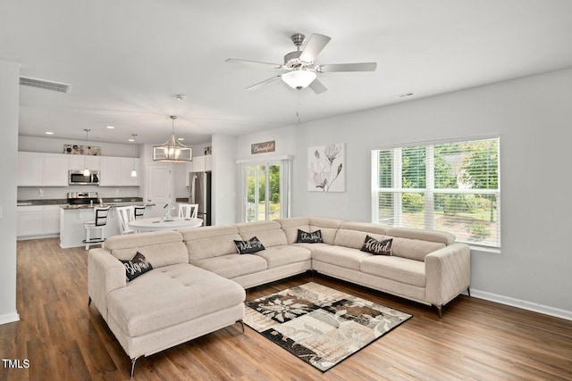 10 Forest Brook Way, Clayton, NC 27520 - living area with a ceiling fan, wood finished floors, baseboards, and recessed lighting