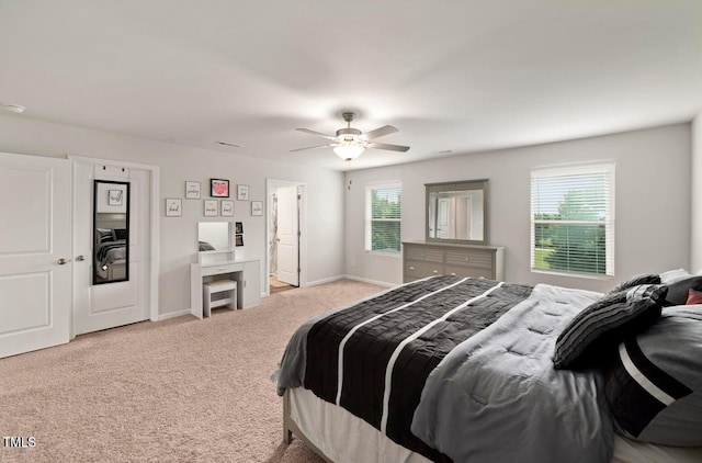 10 Forest Brook Way, Clayton, NC 27520 - carpeted bedroom with multiple windows, a ceiling fan, and baseboards