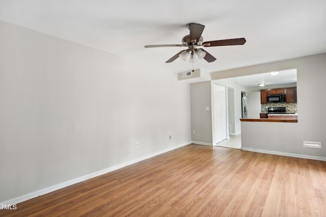104 Benedict Ln, Raleigh, NC 27614 - unfurnished living room with ceiling fan, light wood-type flooring, and baseboards