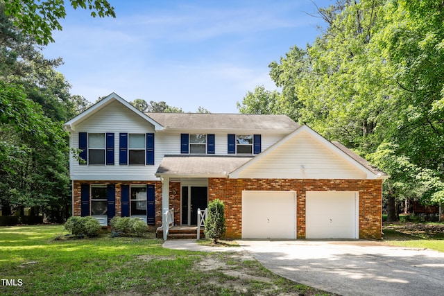 104 Benedict Ln, Raleigh, NC 27614 - view of front of house featuring a porch, an attached garage, concrete driveway, a front yard, and brick siding