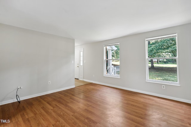 104 Benedict Ln, Raleigh, NC 27614 - unfurnished room with healthy amount of natural light, light wood-style flooring, and baseboards