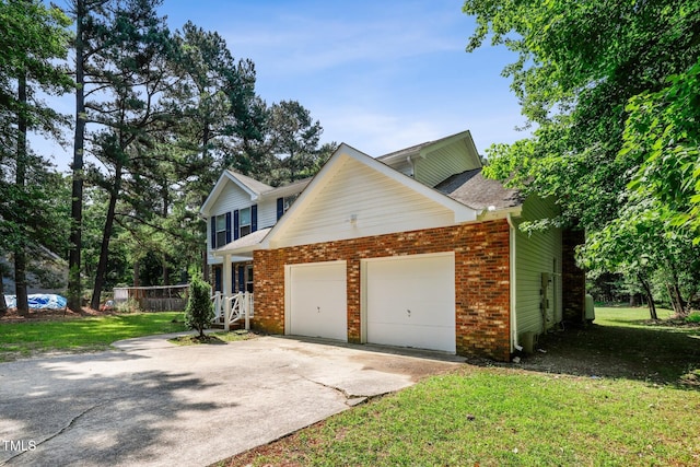 104 Benedict Ln, Raleigh, NC 27614 - view of side of property with a garage, brick siding, concrete driveway, a yard, and roof with shingles