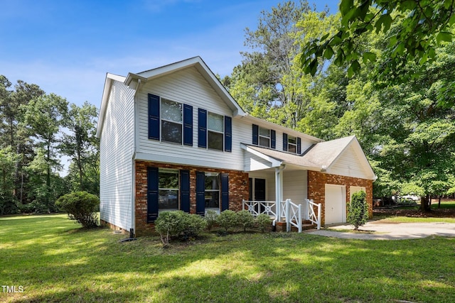 104 Benedict Ln, Raleigh, NC 27614 - traditional home featuring covered porch, an attached garage, driveway, and a front lawn