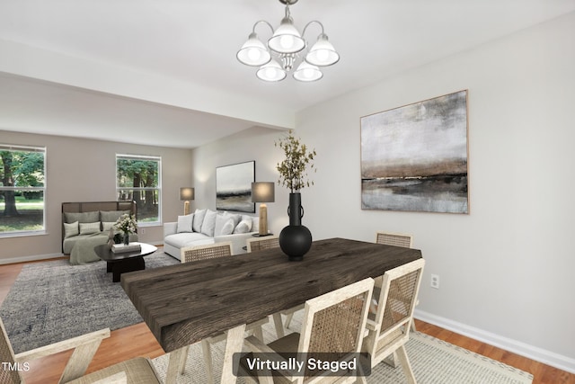 104 Benedict Ln, Raleigh, NC 27614 - dining space with a chandelier, baseboards, and wood finished floors