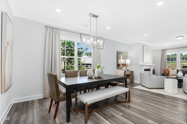321 Calvander Ln, Apex, NC 27539 - dining room with a chandelier, crown molding, wood finished floors, recessed lighting, and baseboards