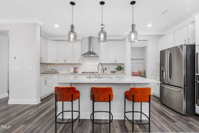 321 Calvander Ln, Apex, NC 27539 - kitchen featuring stainless steel fridge, wall chimney exhaust hood, a sink, light countertops, and tasteful backsplash