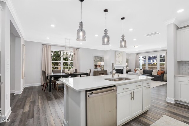 321 Calvander Ln, Apex, NC 27539 - kitchen featuring dishwasher, recessed lighting, a sink, ornamental molding, and light countertops