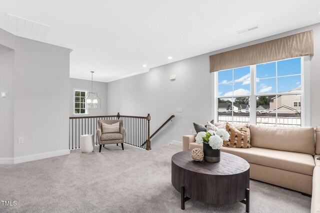 321 Calvander Ln, Apex, NC 27539 - carpeted living area with a chandelier, baseboards, and recessed lighting