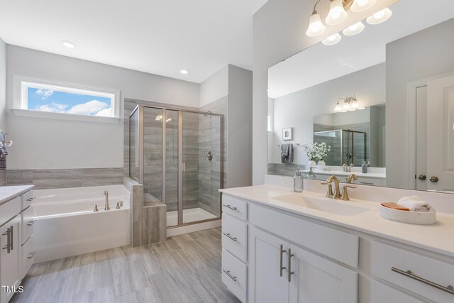 321 Calvander Ln, Apex, NC 27539 - bathroom with vanity, a stall shower, and a garden tub