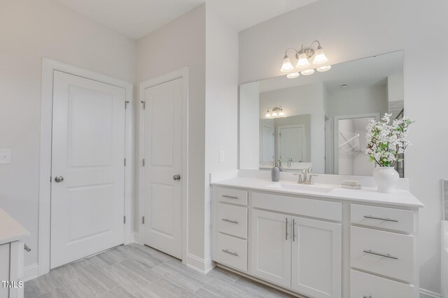 321 Calvander Ln, Apex, NC 27539 - bathroom featuring vanity and baseboards