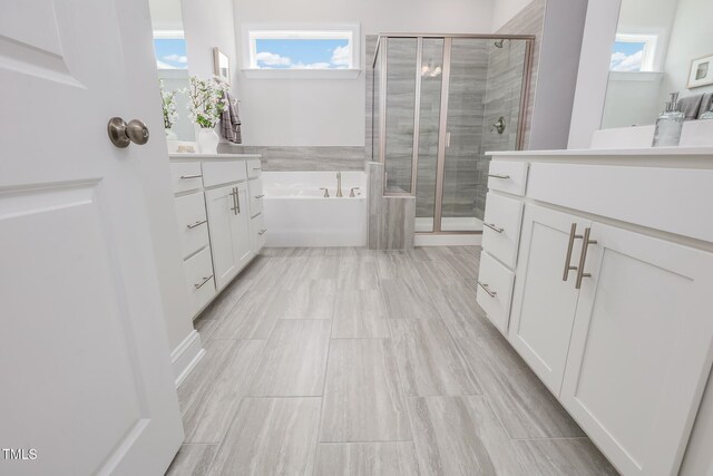 321 Calvander Ln, Apex, NC 27539 - bathroom with vanity, a stall shower, and a bath