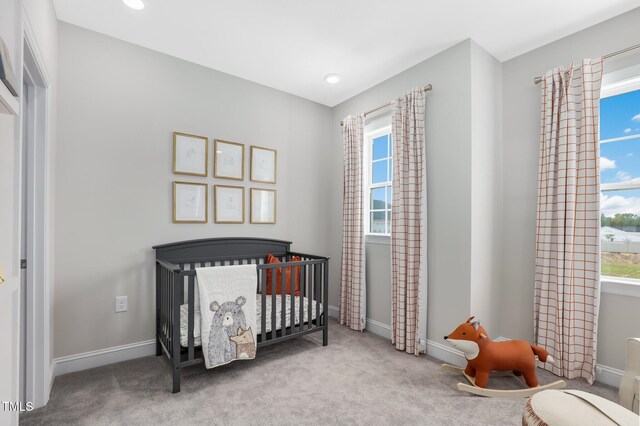 321 Calvander Ln, Apex, NC 27539 - bedroom with a nursery area, carpet floors, baseboards, and recessed lighting