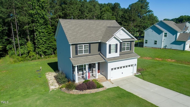 933 Weatherby Ln, Creedmoor, NC 27522 - traditional home featuring concrete driveway, roof with shingles, a garage, and a front yard