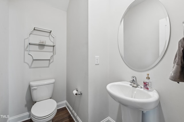 933 Weatherby Ln, Creedmoor, NC 27522 - half bathroom with toilet and wood finished floors