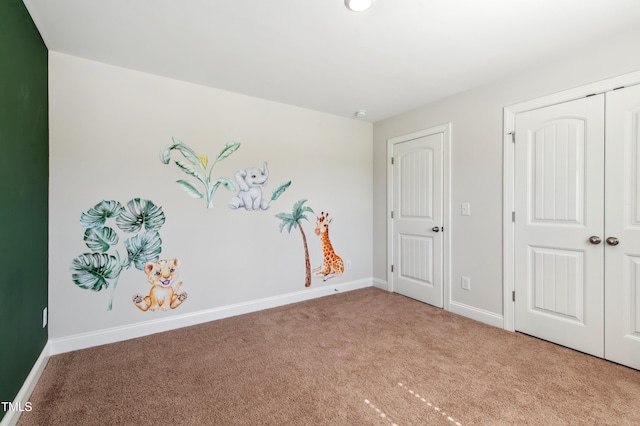 933 Weatherby Ln, Creedmoor, NC 27522 - unfurnished bedroom featuring light colored carpet and a closet