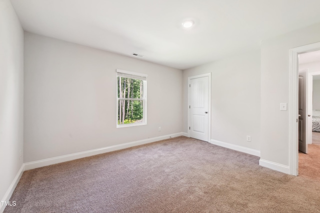 933 Weatherby Ln, Creedmoor, NC 27522 - unfurnished bedroom featuring light colored carpet