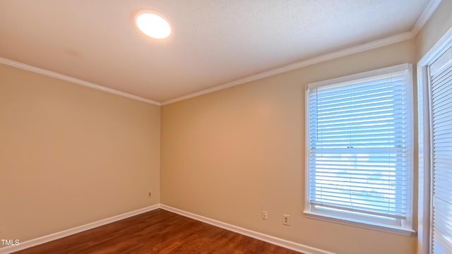 1446 Cimarron Pkwy Unit 64, Wake Forest, NC 27587 - spare room with dark wood finished floors, baseboards, and ornamental molding