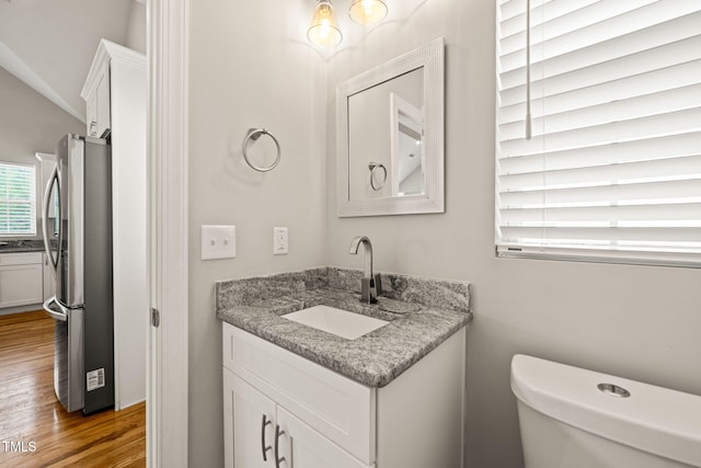 225 E End Ave, Durham, NC 27703 - bathroom featuring wood finished floors, vanity, and toilet