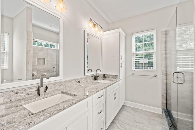225 E End Ave, Durham, NC 27703 - full bath with marble look tile flooring, double vanity, healthy amount of natural light, and a stall shower