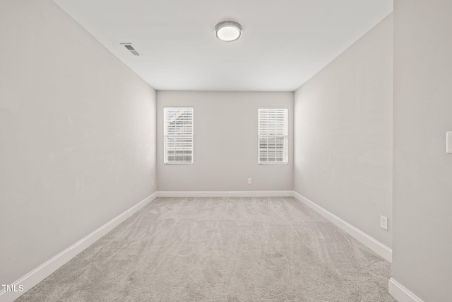 225 E End Ave, Durham, NC 27703 - carpeted empty room with baseboards