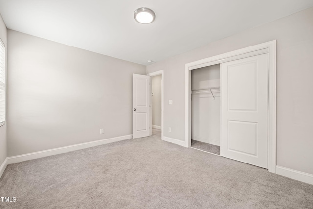 225 E End Ave, Durham, NC 27703 - unfurnished bedroom with carpet floors, baseboards, and a closet