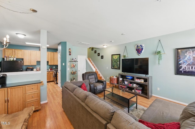 8620 Neuse Club Ln Unit 107, Raleigh, NC 27616 - living room featuring light wood-style floors and stairs