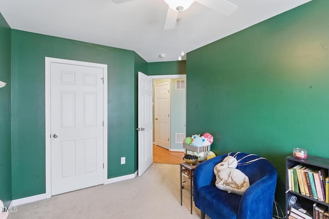 8620 Neuse Club Ln Unit 107, Raleigh, NC 27616 - living area with ceiling fan and carpet