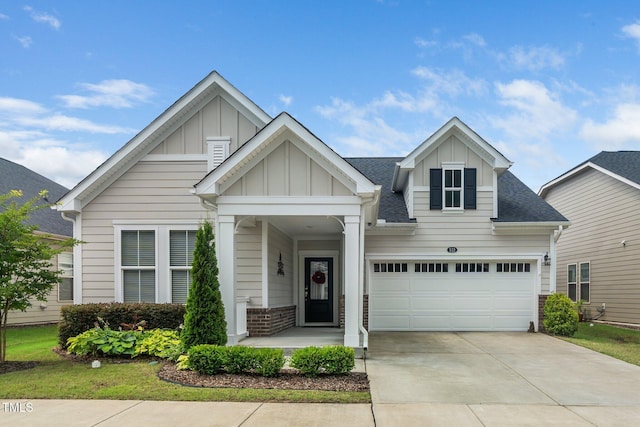512 Courtship Cv, Durham, NC 27703 - craftsman house with board and batten siding, concrete driveway, a shingled roof, and an attached garage