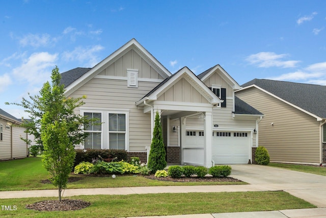 512 Courtship Cv, Durham, NC 27703 - craftsman inspired home featuring board and batten siding, concrete driveway, brick siding, a front yard, and roof with shingles