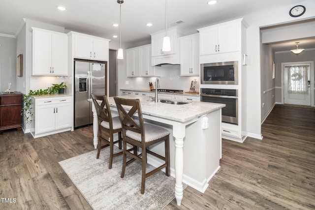 512 Courtship Cv, Durham, NC 27703 - kitchen featuring stainless steel appliances, dark wood-style floors, white cabinetry, a center island with sink, and recessed lighting