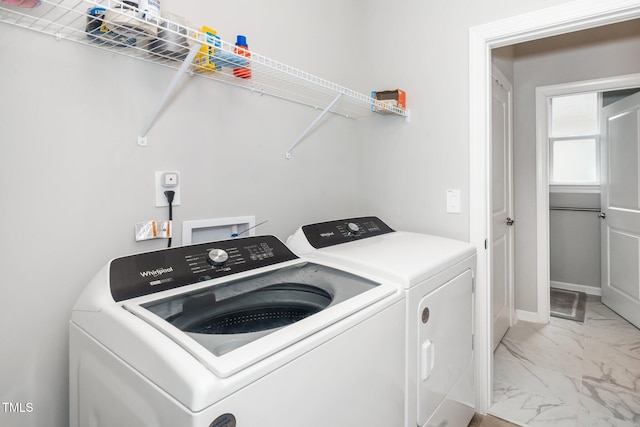 512 Courtship Cv, Durham, NC 27703 - laundry room featuring washing machine and clothes dryer and light marble finish floors