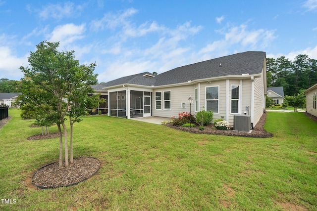 512 Courtship Cv, Durham, NC 27703 - rear view of property featuring a sunroom, a yard, and a shingled roof