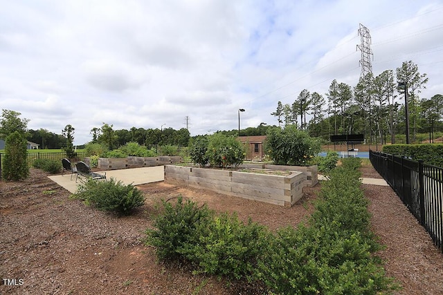 512 Courtship Cv, Durham, NC 27703 - view of yard with a vegetable garden and a patio