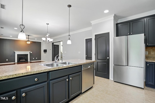 409 Kilcornac Ct, Fuquay Varina, NC 27526 - kitchen with stainless steel appliances, a sink, a ceiling fan, ornamental molding, and a fireplace