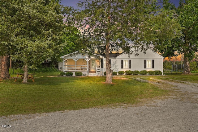 784 Crawford Rd, Coats, NC 27521 - ranch-style house featuring a front yard, covered porch, and driveway