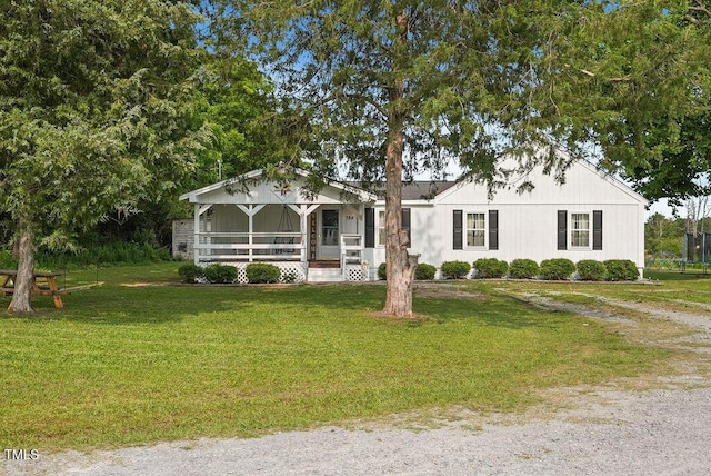 784 Crawford Rd, Coats, NC 27521 - view of front of house with covered porch and a front lawn