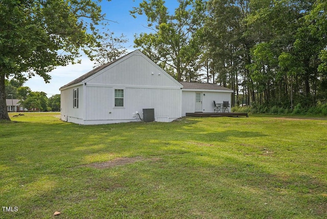 784 Crawford Rd, Coats, NC 27521 - view of property exterior with a deck, central AC, and a lawn