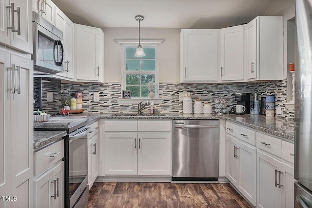 784 Crawford Rd, Coats, NC 27521 - kitchen with appliances with stainless steel finishes, a sink, white cabinets, and backsplash