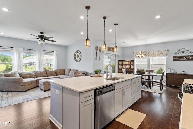 209 Sage Oak Ln, Holly Springs, NC 27540 - kitchen with stainless steel dishwasher, a sink, healthy amount of natural light, dark wood-style flooring, and recessed lighting