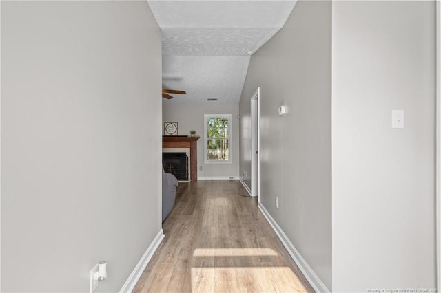 306 Longleaf Pines Dr, Raeford, NC 28376 - hallway with wood finished floors and baseboards