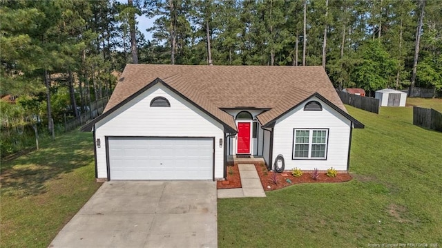 306 Longleaf Pines Dr, Raeford, NC 28376 - ranch-style house with concrete driveway, a garage, view of wooded area, and roof with shingles
