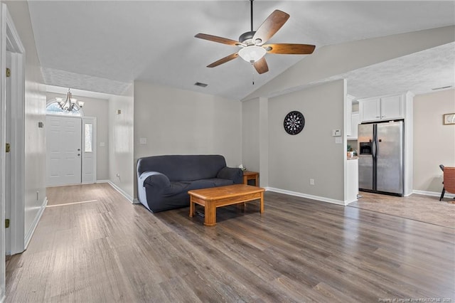 306 Longleaf Pines Dr, Raeford, NC 28376 - living area with a chandelier, baseboards, a ceiling fan, lofted ceiling, and wood finished floors
