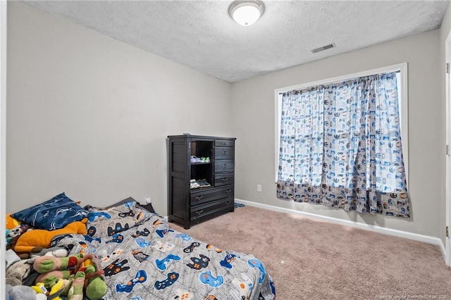 306 Longleaf Pines Dr, Raeford, NC 28376 - carpeted bedroom with a textured ceiling and baseboards