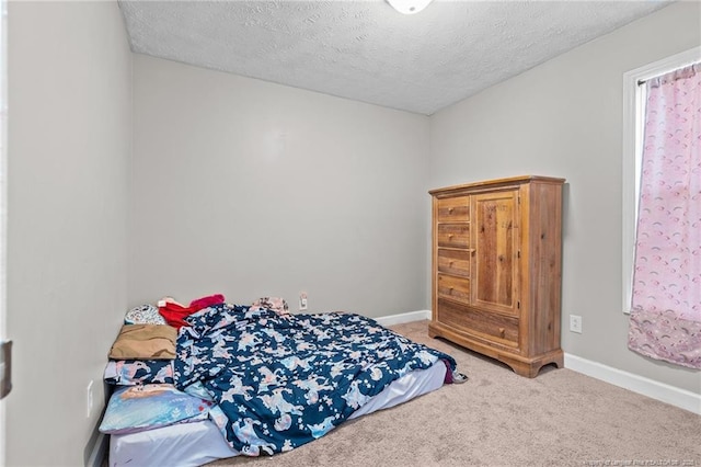 306 Longleaf Pines Dr, Raeford, NC 28376 - carpeted bedroom featuring a textured ceiling and baseboards