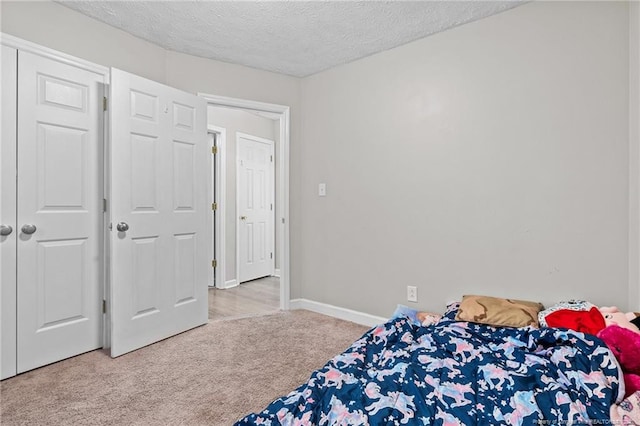 306 Longleaf Pines Dr, Raeford, NC 28376 - bedroom with carpet floors, a textured ceiling, and baseboards