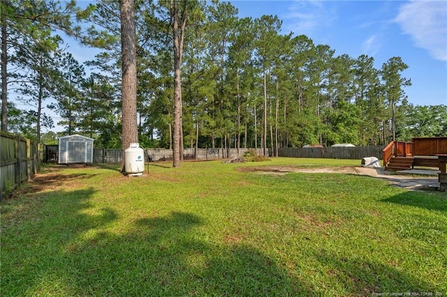 306 Longleaf Pines Dr, Raeford, NC 28376 - view of yard with an outbuilding and a wooden deck