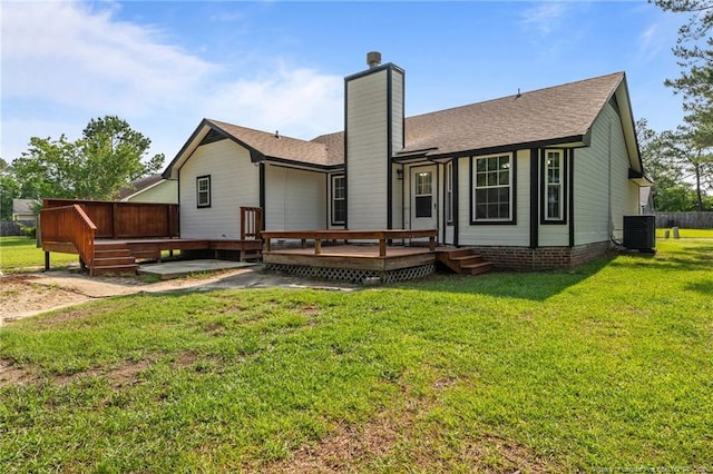 306 Longleaf Pines Dr, Raeford, NC 28376 - back of house with a wooden deck, a chimney, a yard, and cooling unit